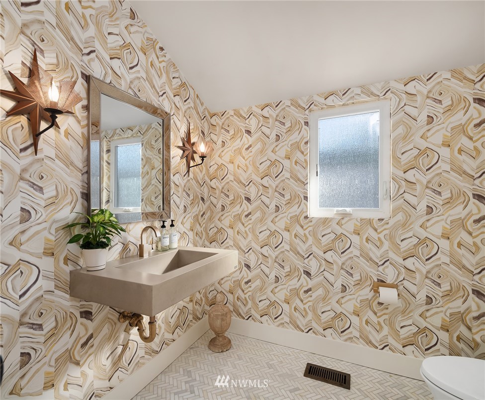 3223 Evergreen Point Road Medina, WA 98039 - Photo 18 of 36 a bathroom with a sink and mirror with bathtub