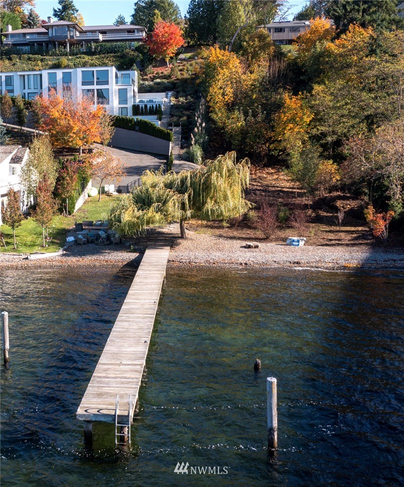3223 Evergreen Point Road Medina, WA 98039 - Photo 34 of 36 a view of a lake with couches and wooden floor