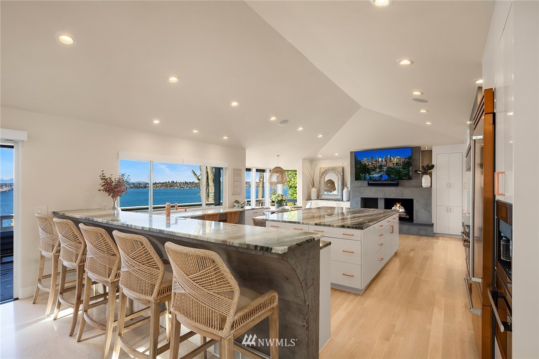 3223 Evergreen Point Road Medina, WA 98039 - Photo 6 of 36 a kitchen with stainless steel appliances kitchen island granite countertop a sink and cabinets