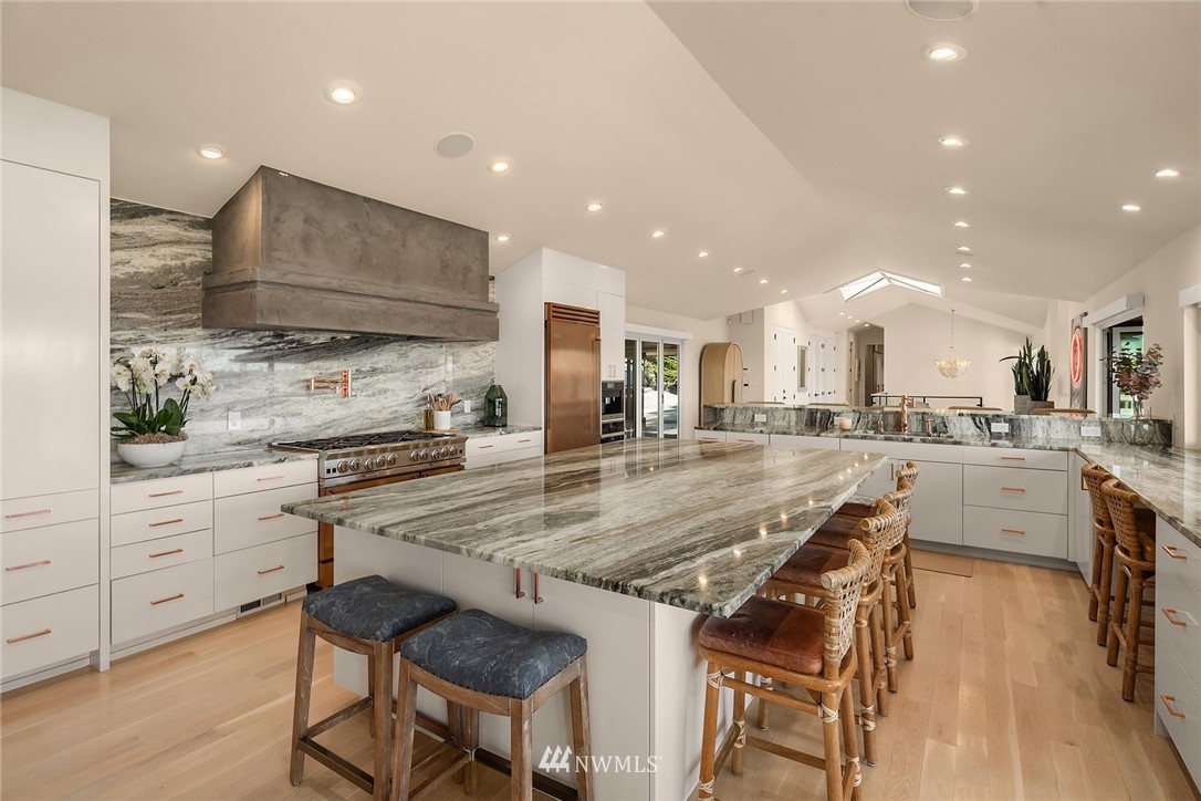 3223 Evergreen Point Road Medina, WA 98039 - Photo 9 of 36 a kitchen with stainless steel appliances granite countertop a stove top oven a sink a refrigerator and white cabinets