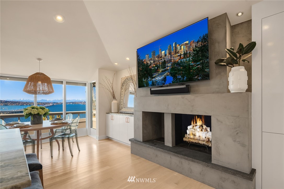 3223 Evergreen Point Road Medina, WA 98039 - Photo 10 of 36 a living room with furniture a chandelier and a fireplace