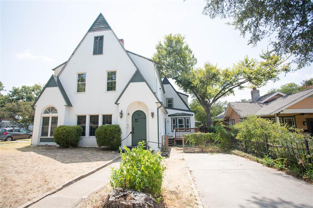201 West 33rd Street, Unit A Austin, TX 78705 - Photo 1 of 20 a view of a white house with a yard and plants