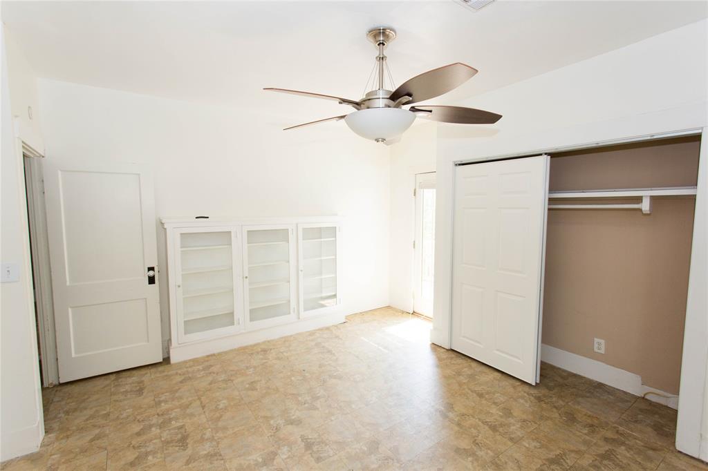 201 West 33rd Street, Unit A Austin, TX 78705 - Photo 13 of 20 an empty room with closet and a chandelier fan