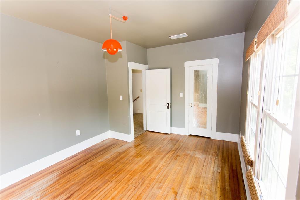 201 West 33rd Street, Unit A Austin, TX 78705 - Photo 15 of 20 a view of a room with wooden floor and a window