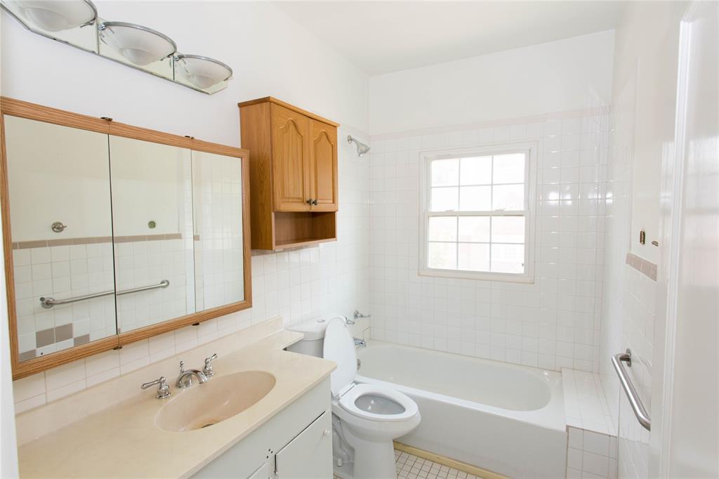 201 West 33rd Street, Unit A Austin, TX 78705 - Photo 16 of 20 a bathroom with a sink a toilet and shower
