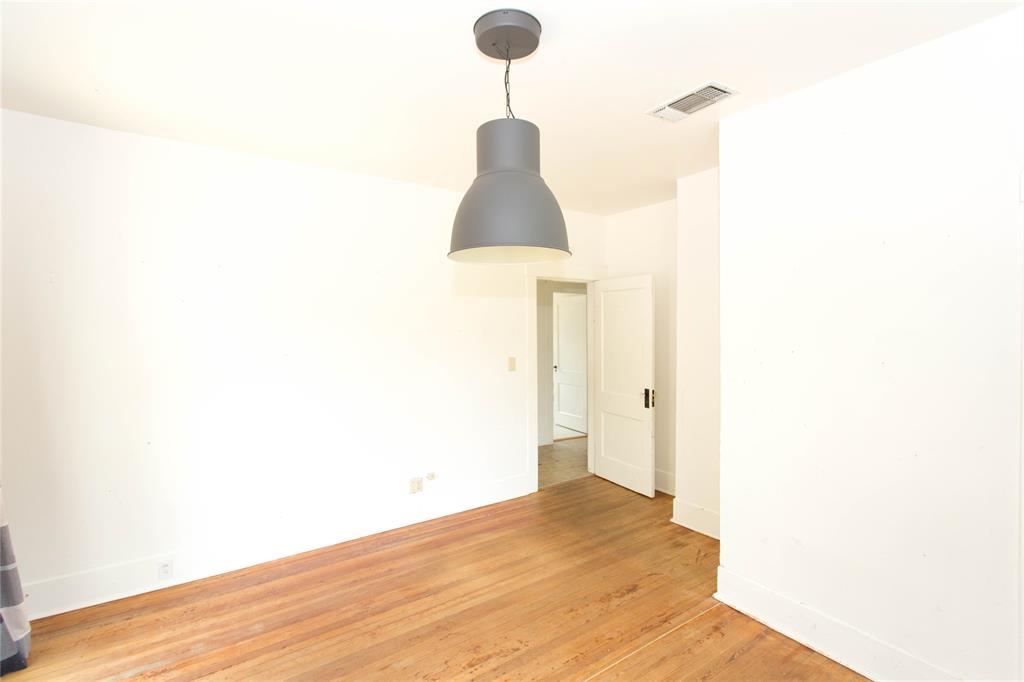 201 West 33rd Street, Unit A Austin, TX 78705 - Photo 20 of 20 a view of a hallway with a chandelier