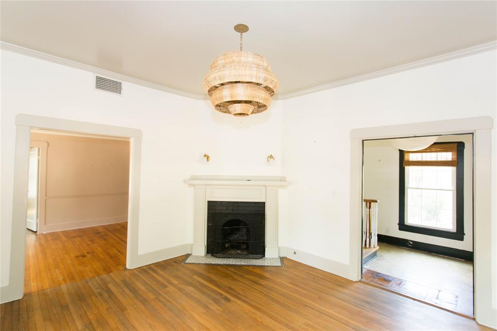 201 West 33rd Street, Unit A Austin, TX 78705 - Photo 3 of 20 a view of an empty room with wooden floor and a window