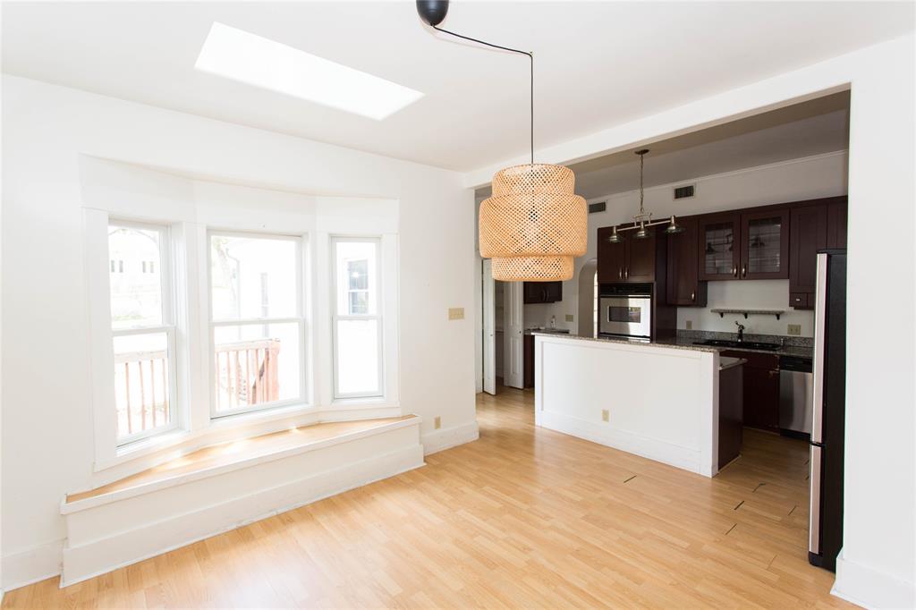 201 West 33rd Street, Unit A Austin, TX 78705 - Photo 8 of 20 a kitchen with a refrigerator and a sink