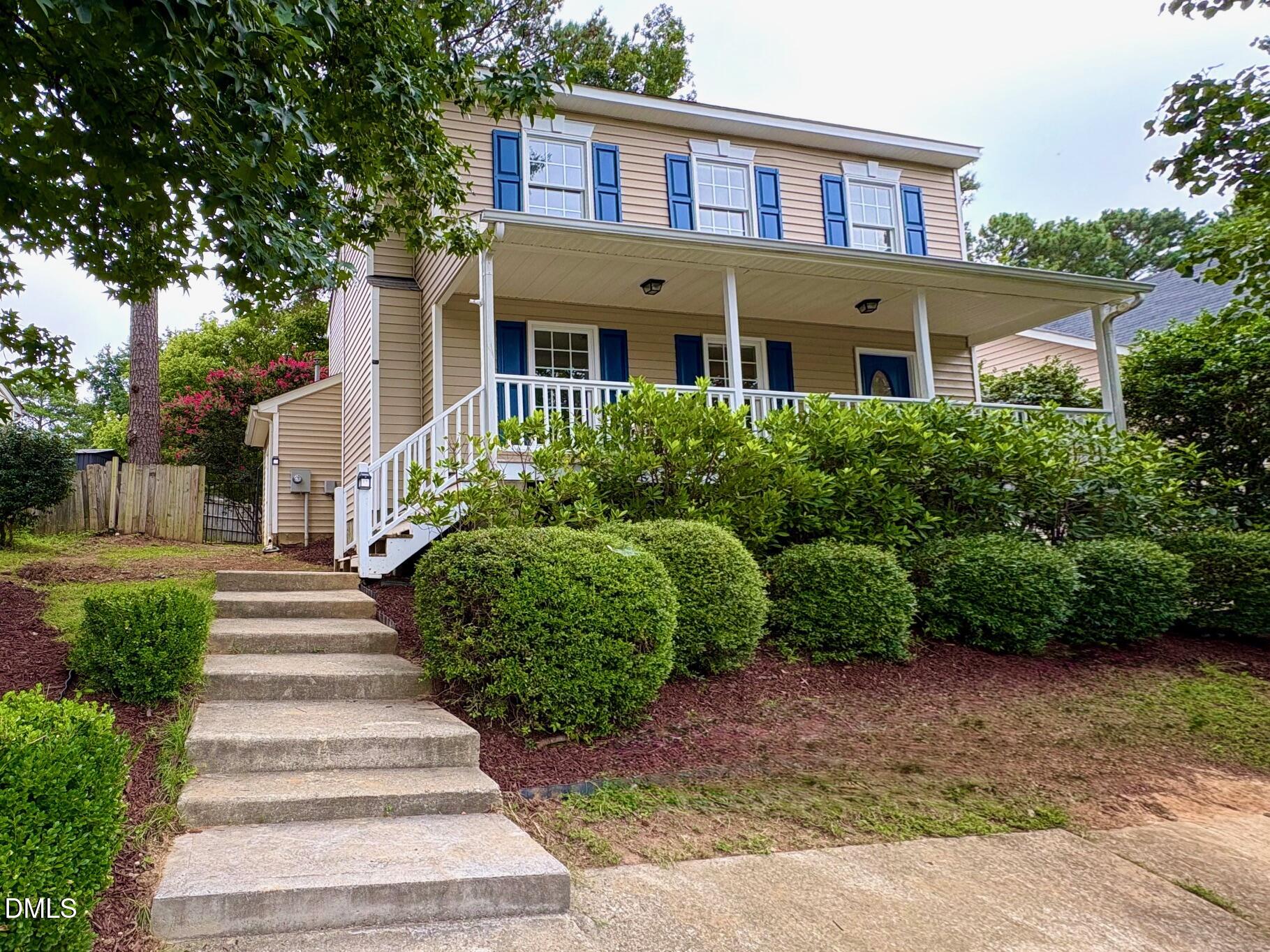 a front view of a building with garden