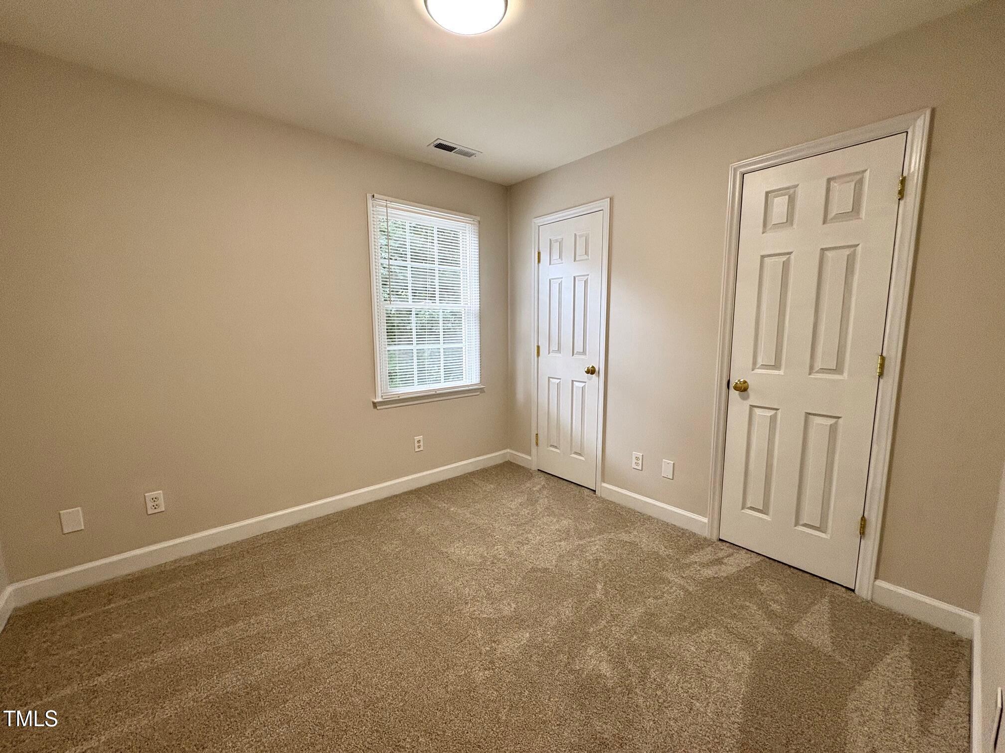 111 Gumdrop Path Apex, NC 27502 - Photo 12 of 17 an empty room with windows