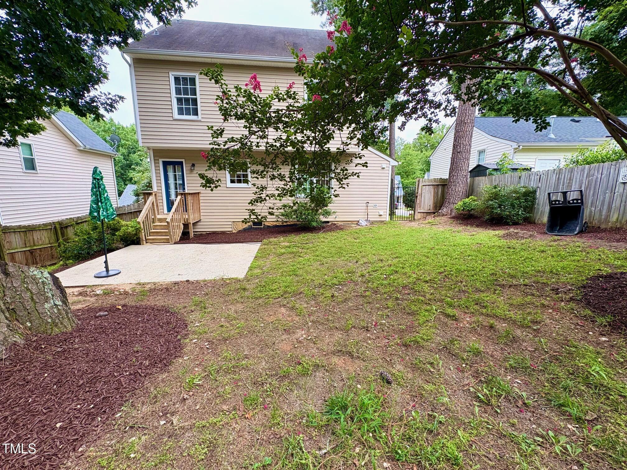 111 Gumdrop Path Apex, NC 27502 - Photo 16 of 17 a front view of a house with a yard and garage