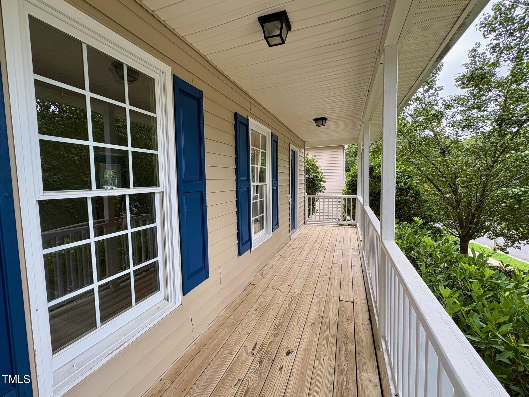 111 Gumdrop Path Apex, NC 27502 - Photo 2 of 17 a view of balcony with wooden floor and fence