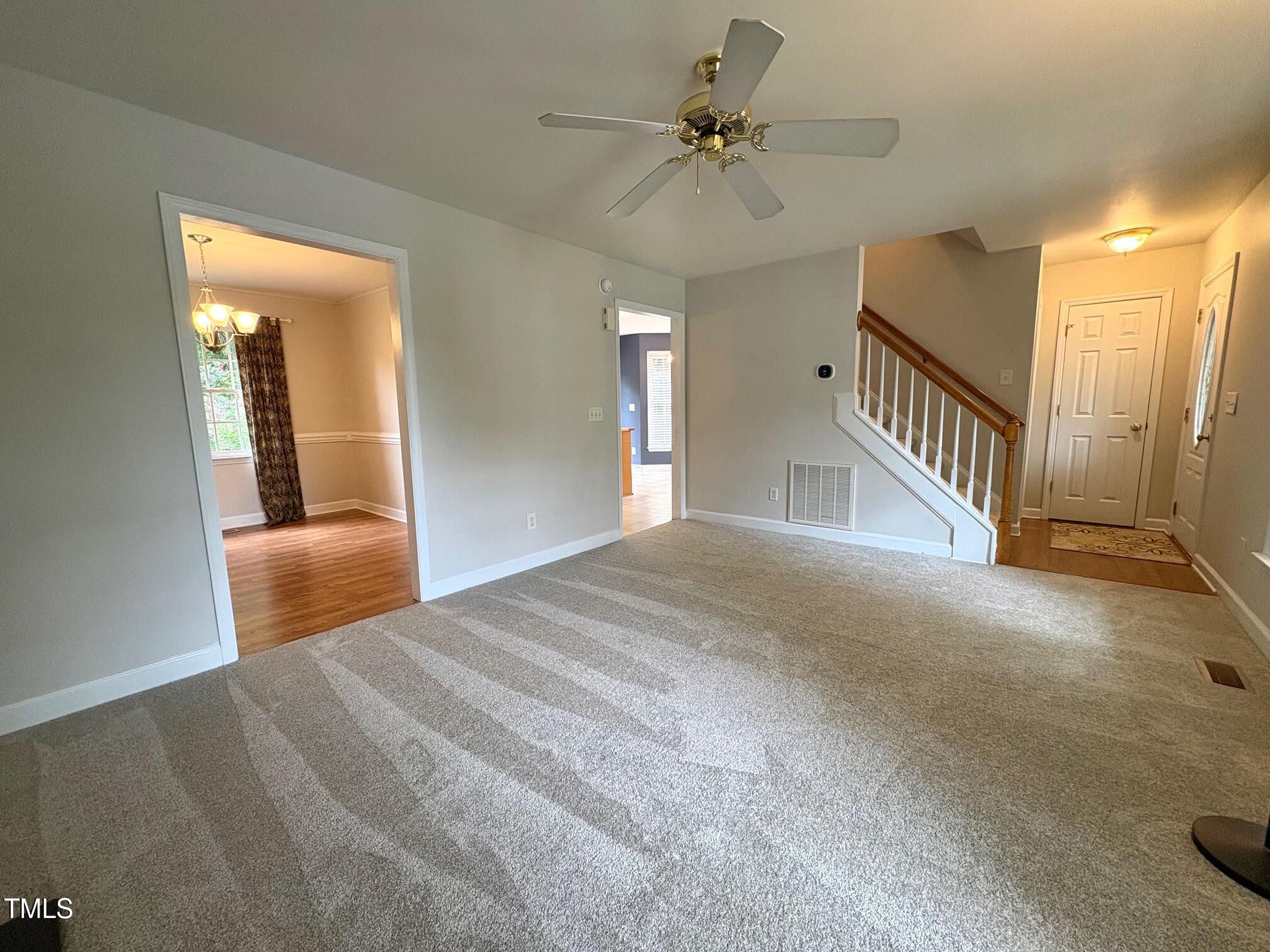 111 Gumdrop Path Apex, NC 27502 - Photo 5 of 17 a view of entryway and hall with a chandelier