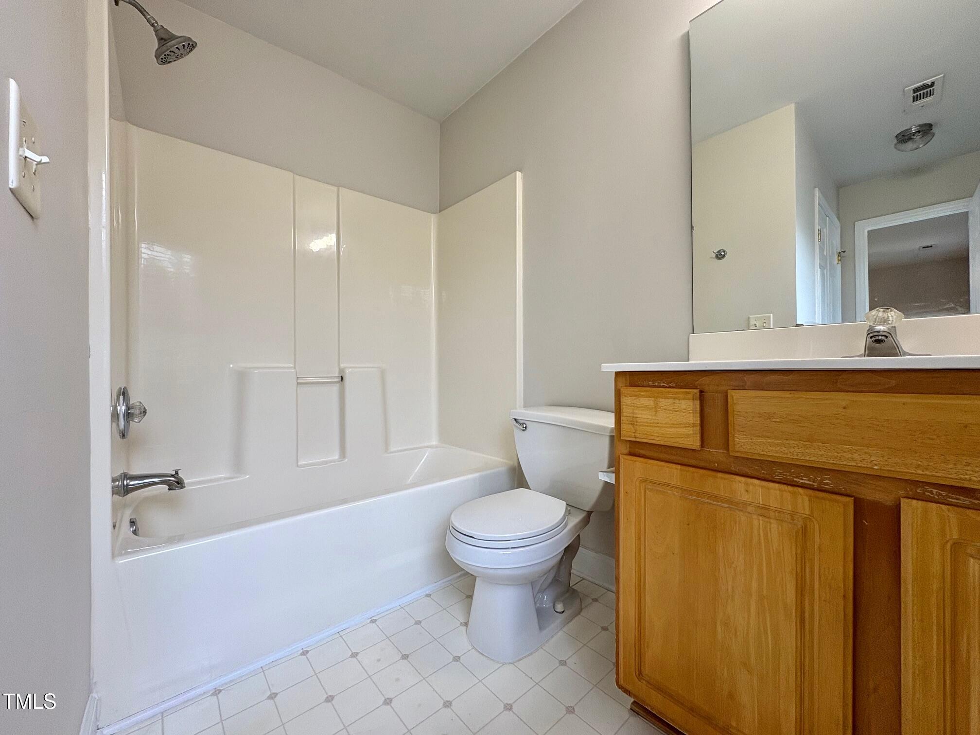 111 Gumdrop Path Apex, NC 27502 - Photo 10 of 17 a bathroom with a sink a toilet and shower