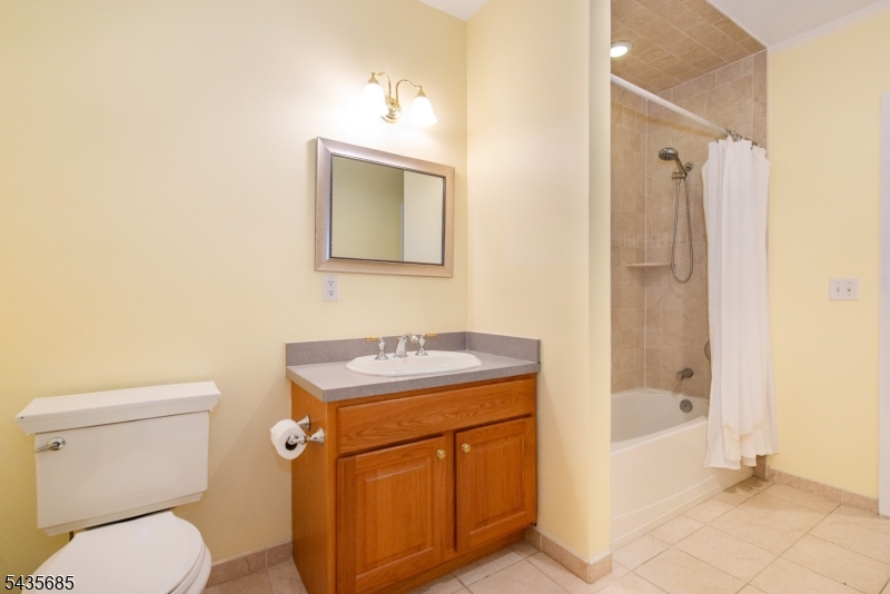 16 Main Street Sparta, NJ 07871 - Photo 21 of 33 a bathroom with a granite countertop toilet sink and mirror