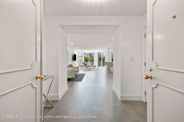 a view of a hallway with seating area