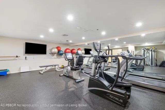a living room with fireplace furniture and a flat screen tv