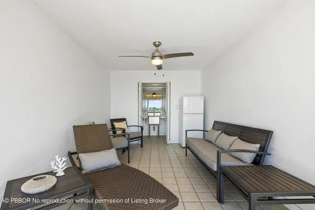 a view of a swimming pool with an outdoor seating and yard