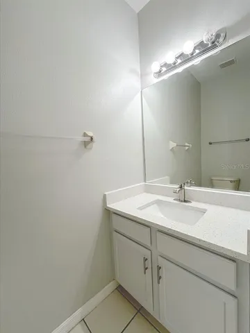 a bathroom with a sink and mirror
