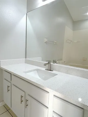 a white bath tub sitting next to a white toilet