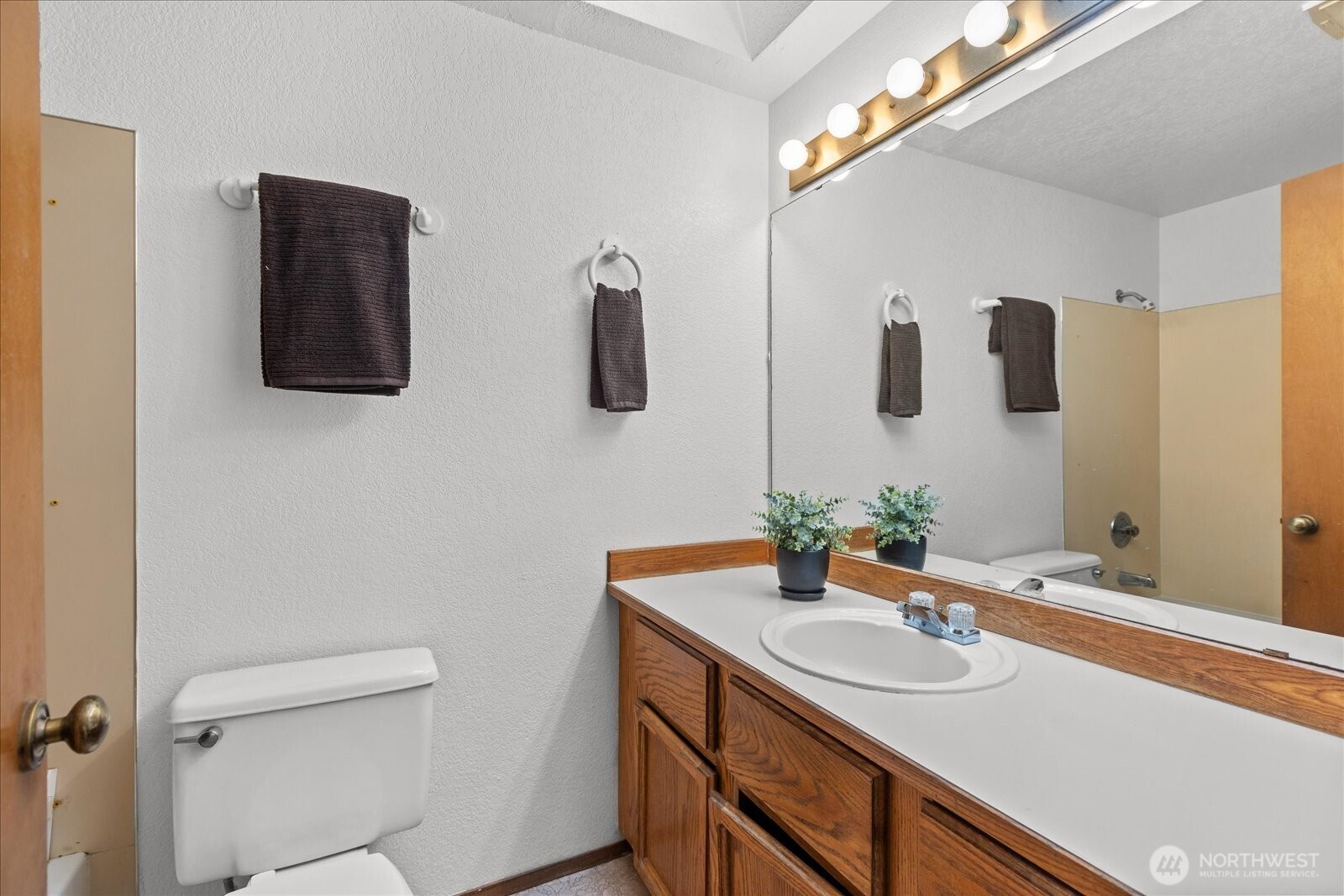 1403 234th Street Southwest Bothell, WA 98021 - Photo 17 of 37 a bathroom with a sink and mirror