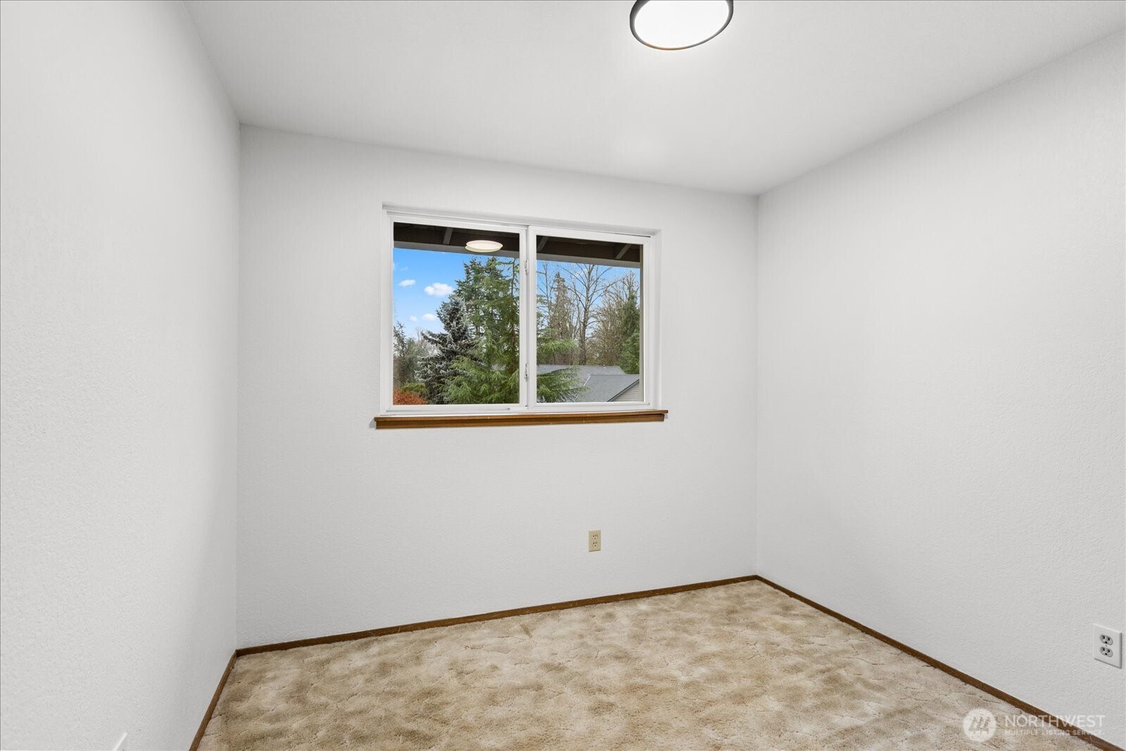 1403 234th Street Southwest Bothell, WA 98021 - Photo 19 of 37 an empty room with a window