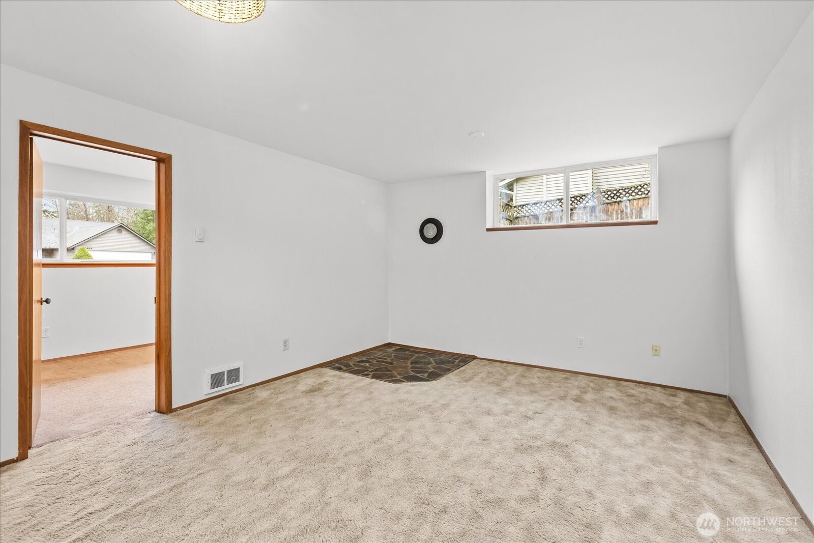 1403 234th Street Southwest Bothell, WA 98021 - Photo 23 of 37 an empty room with a door
