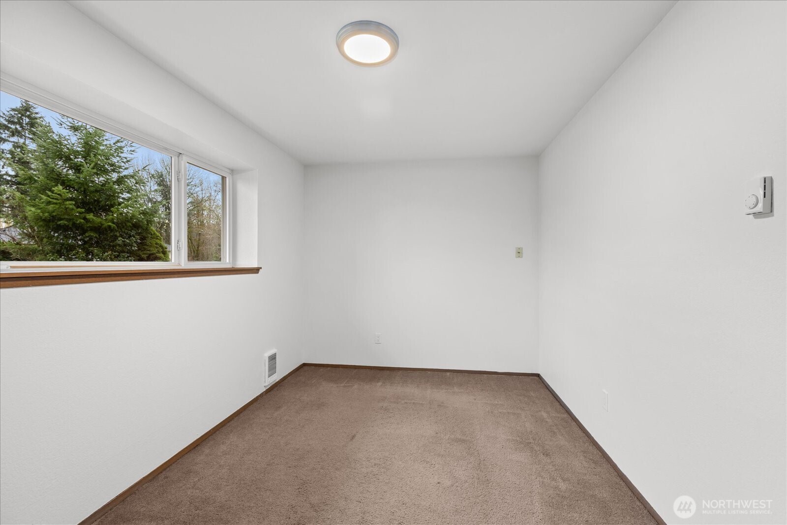 1403 234th Street Southwest Bothell, WA 98021 - Photo 24 of 37 an empty room with a window