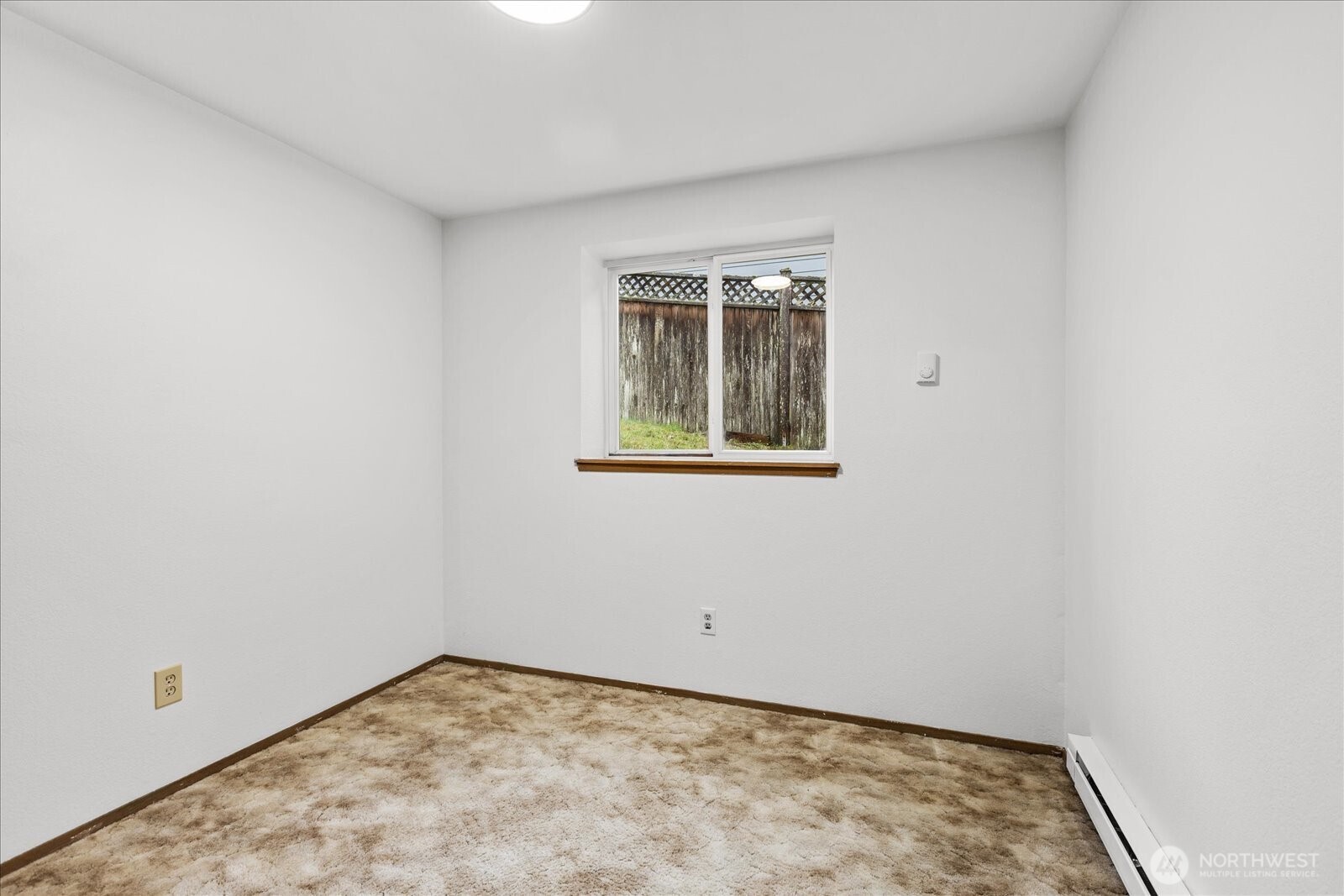 1403 234th Street Southwest Bothell, WA 98021 - Photo 26 of 37 an empty room with a window