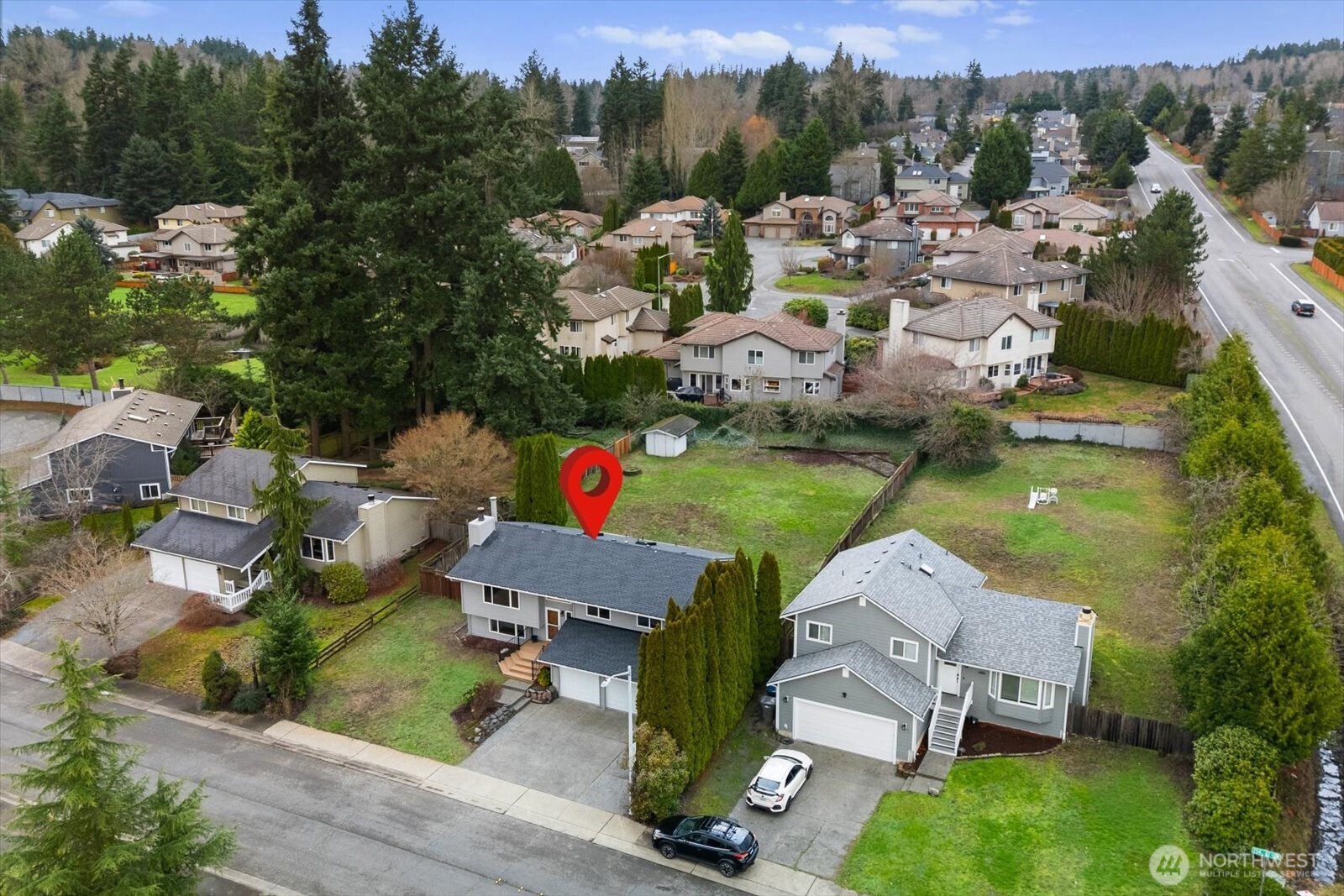 1403 234th Street Southwest Bothell, WA 98021 - Photo 32 of 37 an aerial view of a house with a garden and lake view