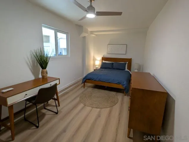 a bedroom with furniture and a window