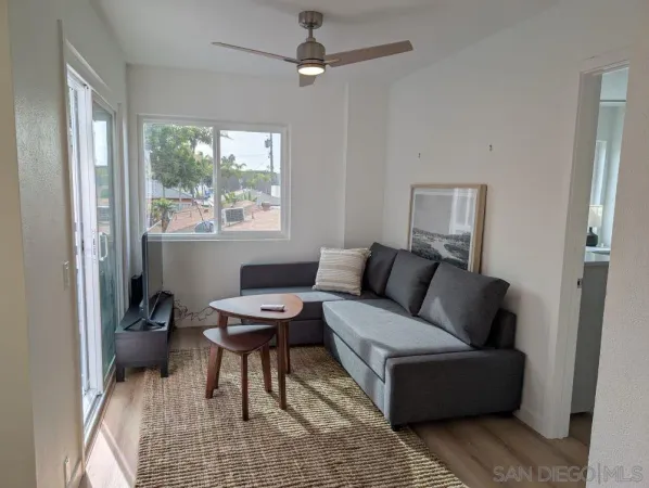 a living room with furniture and a window