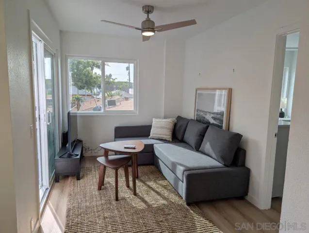 a living room with furniture and a window