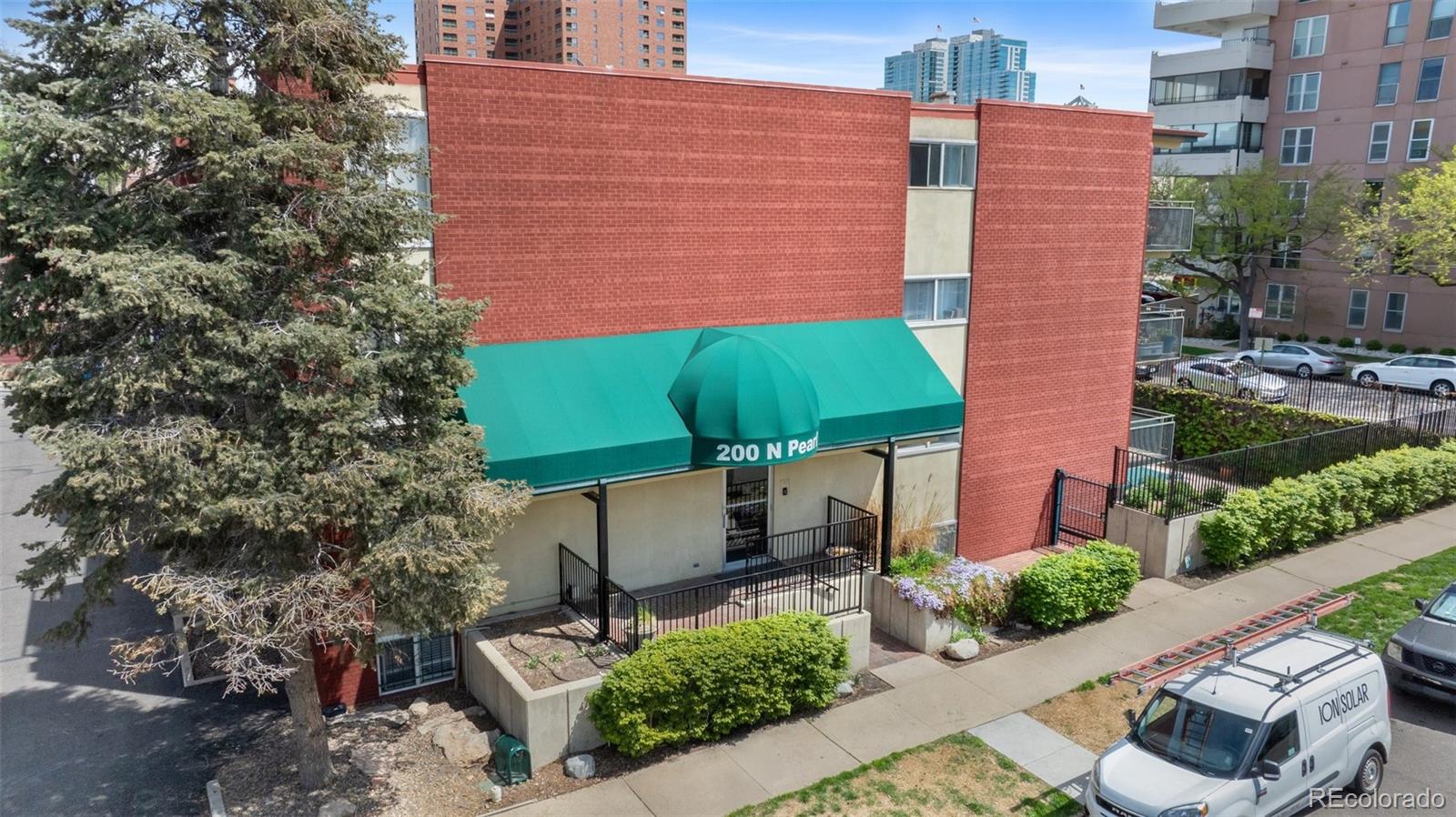 200 Pearl Street, Unit 106 Denver, CO 80203 - Photo 12 of 16 a aerial view of a house with a yard and potted plants