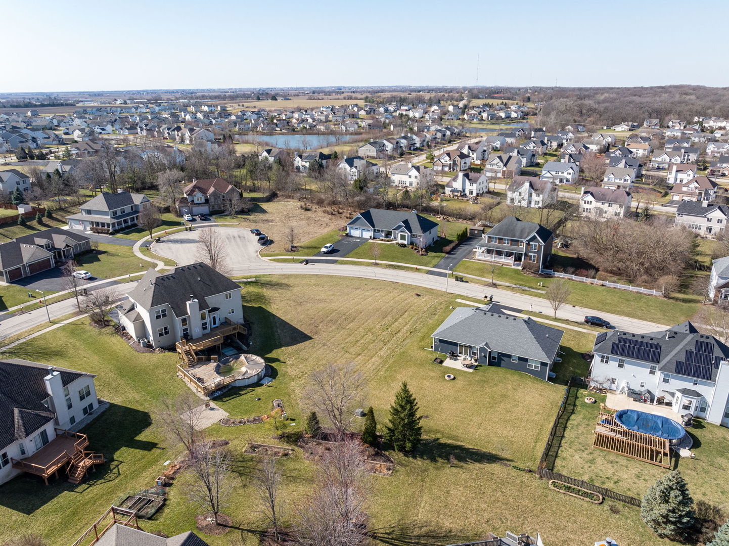 762 Greenfield Turn Yorkville, IL 60560 - Photo 9 of 9 an aerial view of a swimming pool and lake view