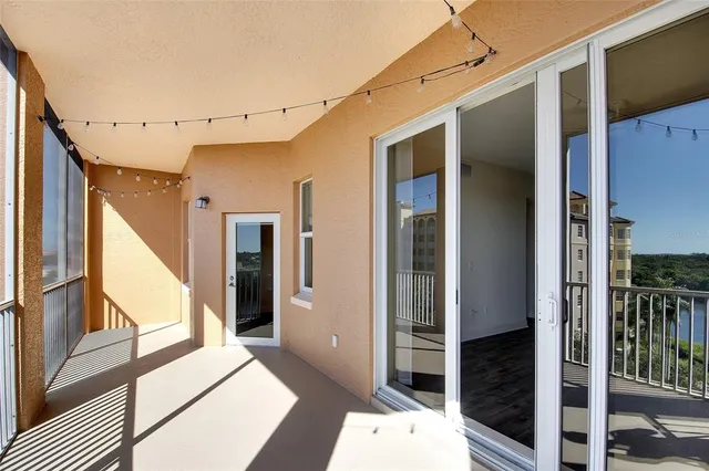 an aerial view of multiple houses with yard