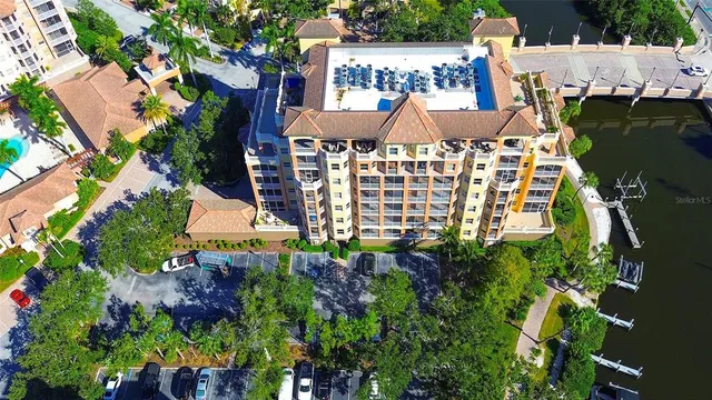 a view of a multi story building with yard