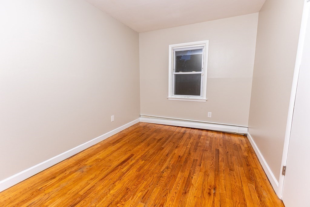 376 Hermitage Drive Springfield, MA 01129 - Photo 13 of 34 a view of an empty room with wooden floor and a window