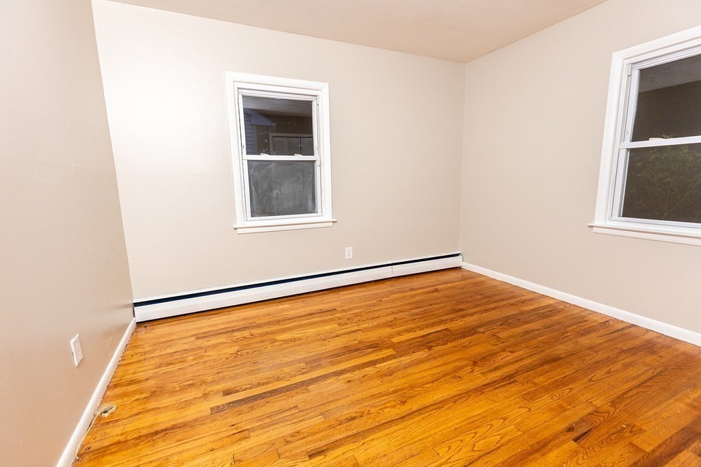 376 Hermitage Drive Springfield, MA 01129 - Photo 14 of 34 a view of empty room with wooden floor and fan