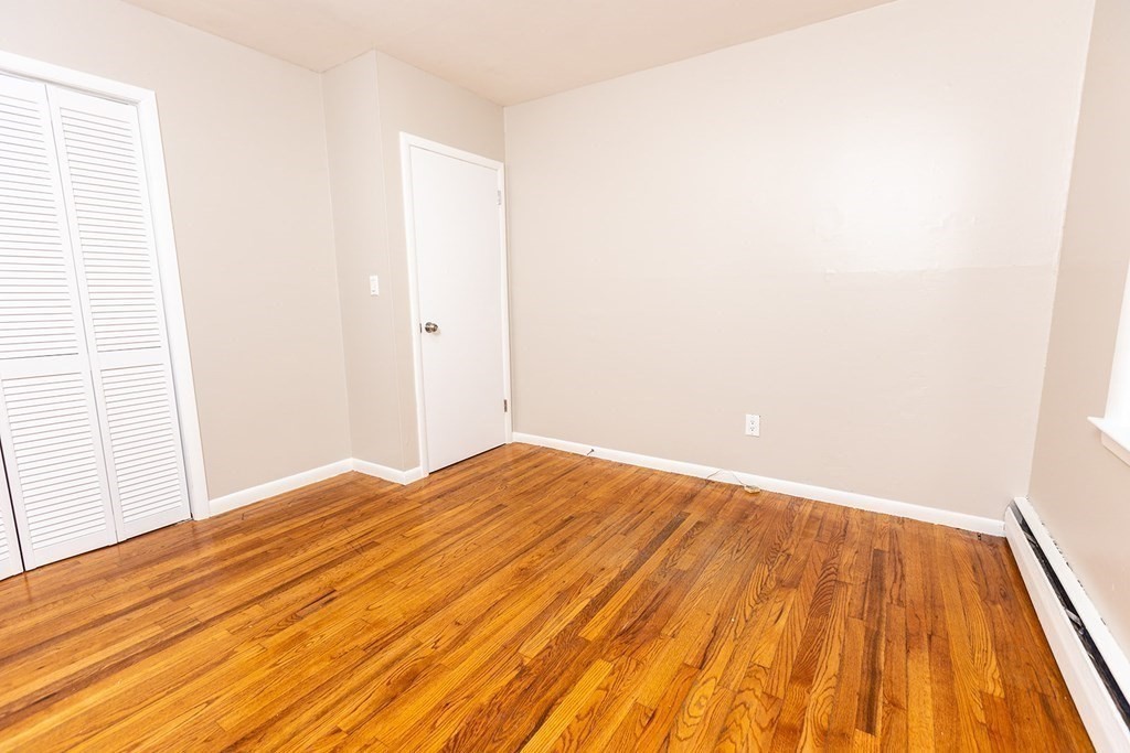 376 Hermitage Drive Springfield, MA 01129 - Photo 17 of 34 a view of empty room with wooden floor