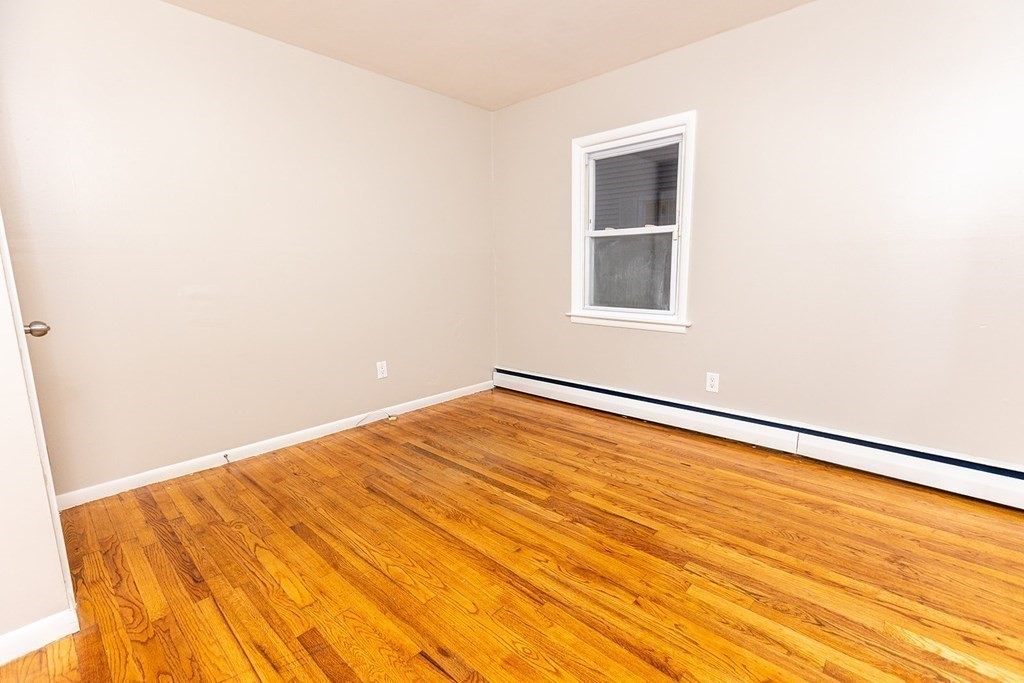 376 Hermitage Drive Springfield, MA 01129 - Photo 18 of 34 an empty room with wooden floor and windows