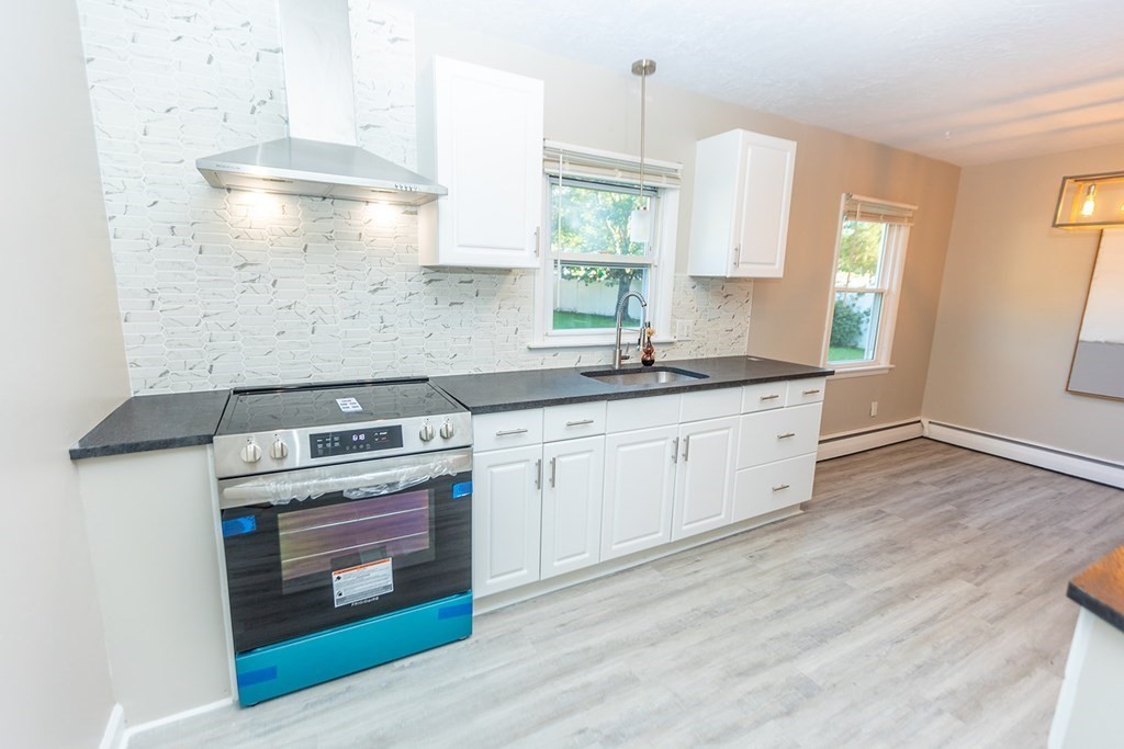 376 Hermitage Drive Springfield, MA 01129 - Photo 2 of 34 a kitchen with a stove oven and sink