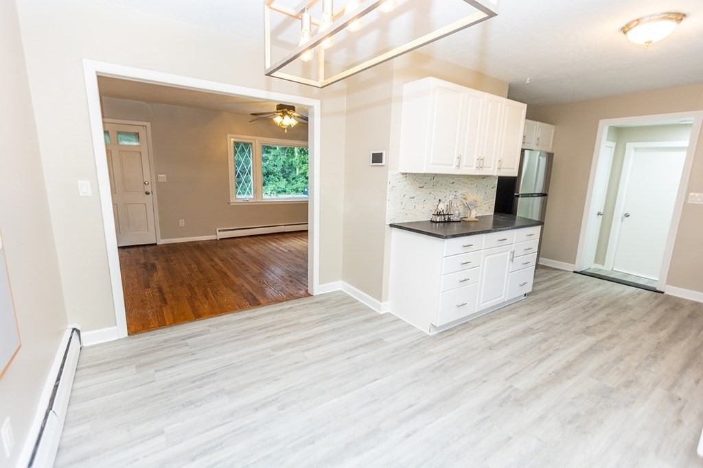 376 Hermitage Drive Springfield, MA 01129 - Photo 4 of 34 a view of a kitchen with wooden floor and electronic appliances