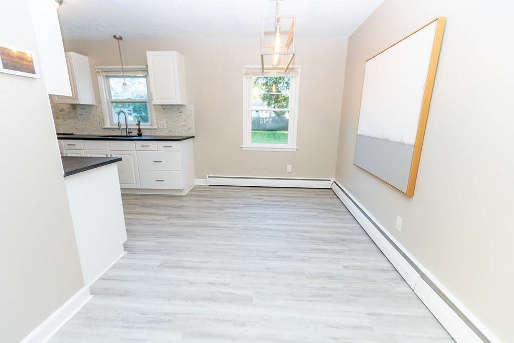 376 Hermitage Drive Springfield, MA 01129 - Photo 5 of 34 a kitchen with granite countertop a sink and a stove top oven