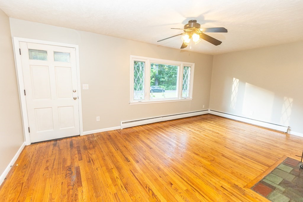 376 Hermitage Drive Springfield, MA 01129 - Photo 6 of 34 a view of empty room with wooden floor and fan