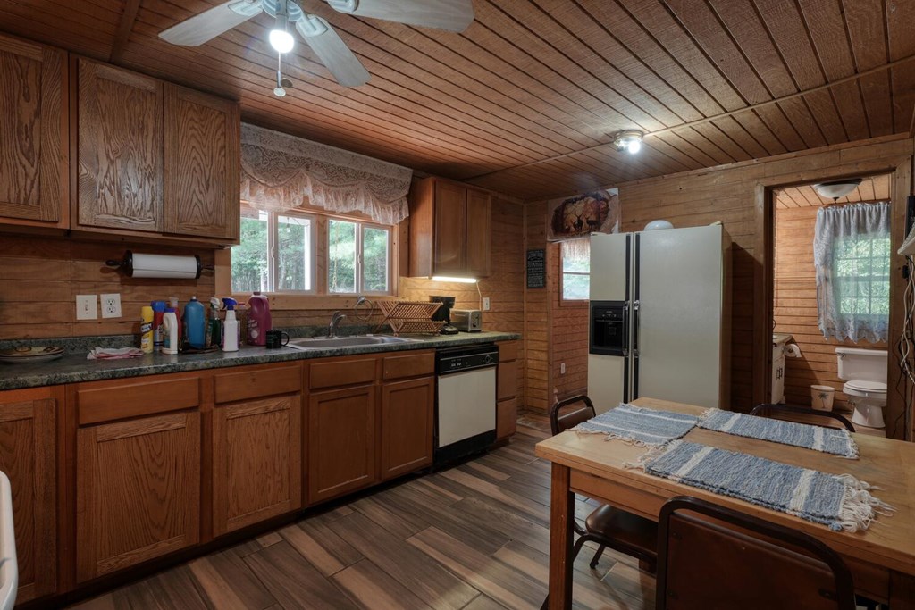 51 Cold Springs Trail Morganton, GA 30560 - Photo 14 of 40 a kitchen with granite countertop cabinets stainless steel appliances a sink and a large window