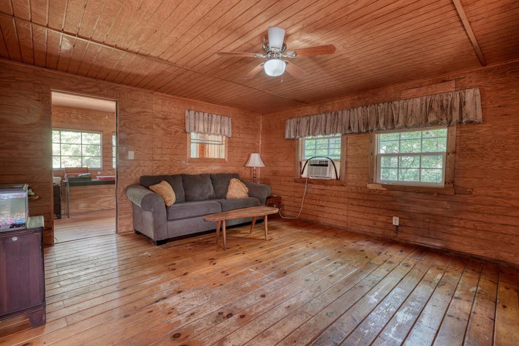 51 Cold Springs Trail Morganton, GA 30560 - Photo 16 of 40 a living room with furniture and wooden floor