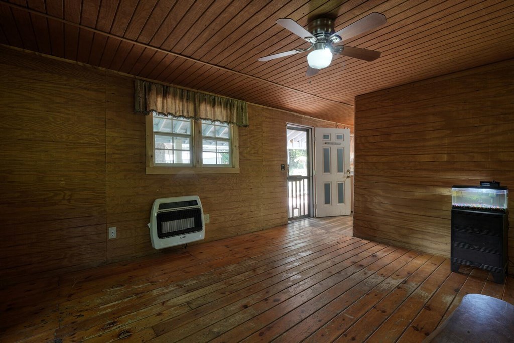 51 Cold Springs Trail Morganton, GA 30560 - Photo 19 of 40 a view of an empty room with a fireplace and a window