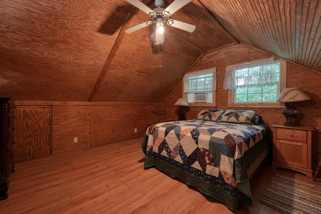 51 Cold Springs Trail Morganton, GA 30560 - Photo 21 of 40 a bedroom with a bed and window