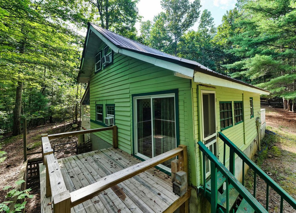 51 Cold Springs Trail Morganton, GA 30560 - Photo 37 of 40 a view of a roof deck with wooden fence and floor